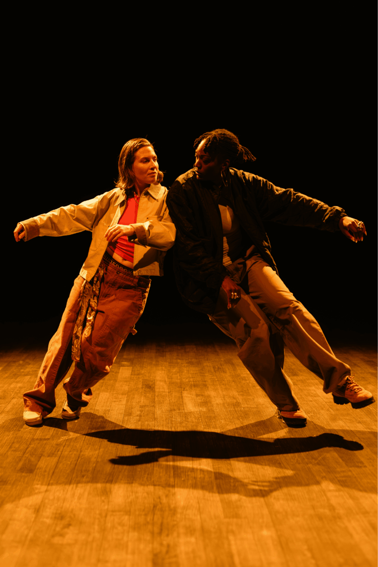 Two interpreters move around the space shoulder to shoulder.